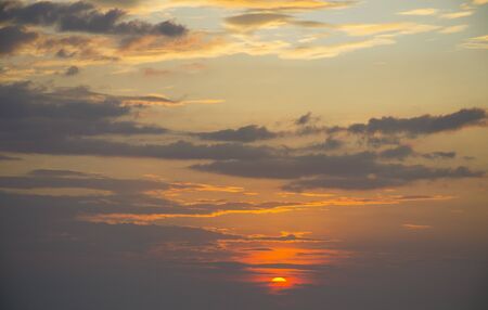 the beautiful sky in clouds at sunset