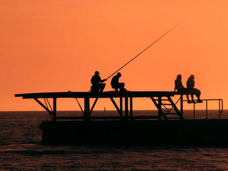 Fishermen on Black Sea at sunset, Sochiの写真素材