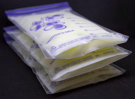 Pumped froxen breastmilk for feeding baby when mom is outの写真素材