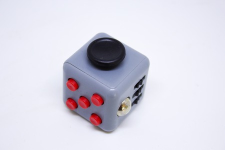 gray fidget cube for relax on whitw backgroundの写真素材