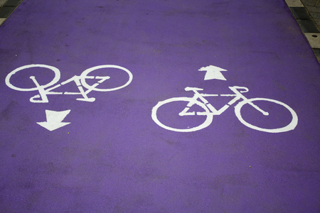 Purple bycicle road with signの写真素材