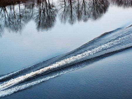 Trace from a boat on waterの写真素材