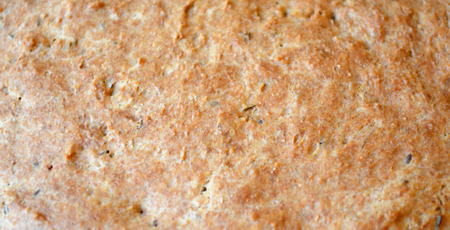 Brown texture of homemade bread with cumin closeup