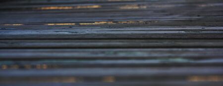 Old scrawny boards. Dark, gloomy colors. Textured backgroundの写真素材