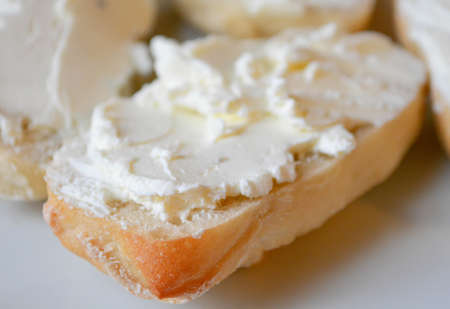 Pieces of ciabatta spread with cream cheese
