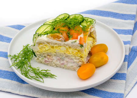 Piece of sandwich cake with ham, cheese and vegetables