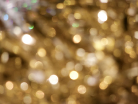 Golden background with abstract spots of light, bokehの写真素材