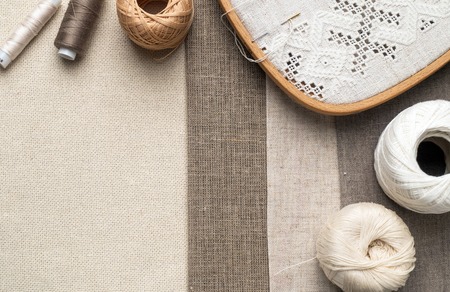 Detail of embroidery on canvas. Yarn, fabric in different colors and thicknesses.の写真素材