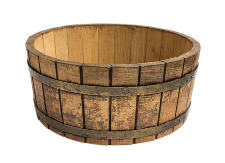 Old round wooden bowl for mixing dough isolated on a white backgroundの写真素材