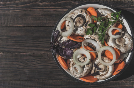 Preparation of pickled mushrooms with vegetables and spicesの写真素材