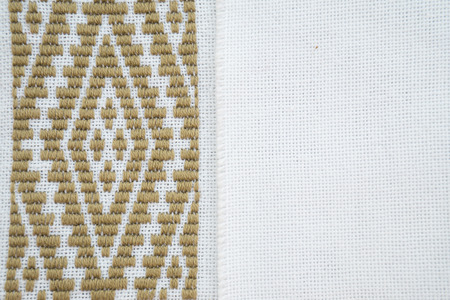 Fragment of hand embroidery on canvas. Background.