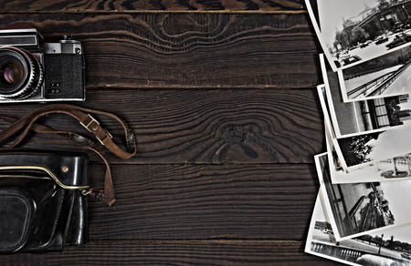 Old camera, acsessories and black and white photographs are on tの写真素材