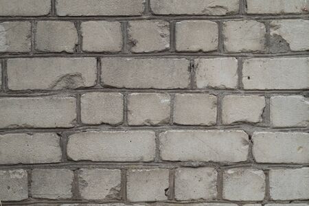 Fragment of the wall of old white bricks