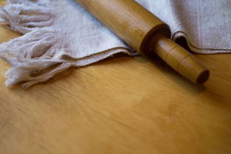 Rolling pin and towel the tableの写真素材