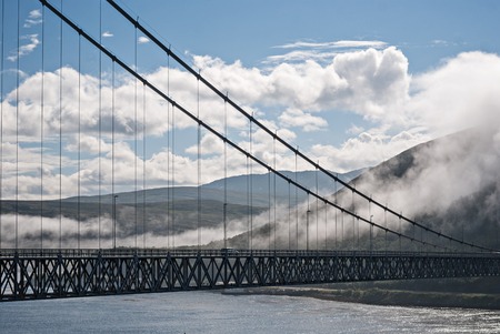 The Kvalsund Bridge is a suspension bridge between the mainland and the island of Kvaloya, Finnmark,...