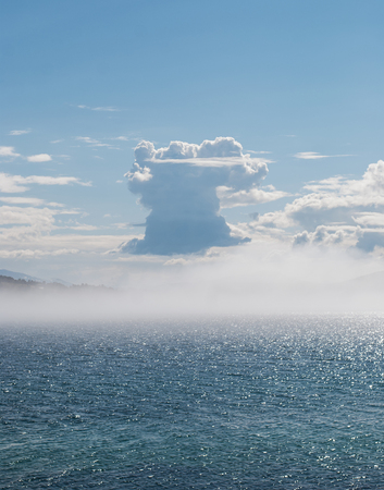 Cumulus clouds over the shining seaの写真素材