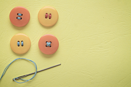 Pastel colors. Yellow and orange buttons on a yellow background
