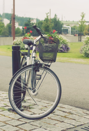 Bicycle parked in the city park, Jyvaskyla, Finlandの写真素材