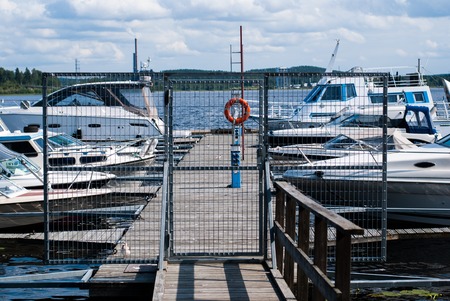 Boats near the pier on the lake, Jyvaskyla, Finlandの写真素材