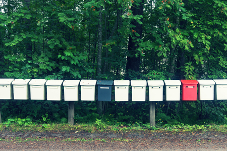 The row multicolored mailboxes in the parkの写真素材