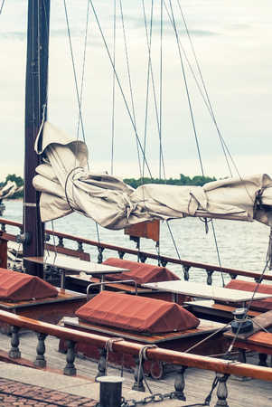 Old yacht at the pier in the harbor of Helsinki, Finlandの写真素材