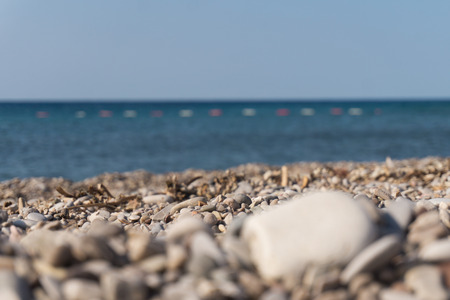 Pebbles on the shore and the sea horizon. Close-upの写真素材