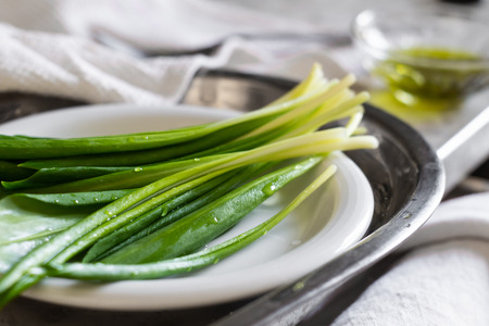 Allium ursinum or wild garlic delicious vitamin plant on plateの写真素材
