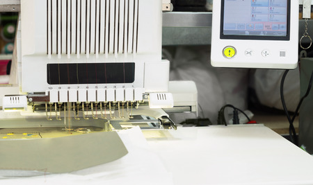 Industrial embroidery machine with software control in the textile production workshop