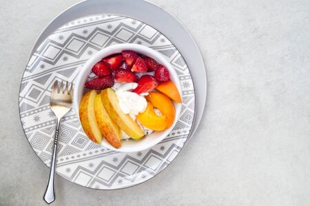 Light vitamin breakfast. Sliced strawberry, apricot and apple with cottage cheese and sour cream....