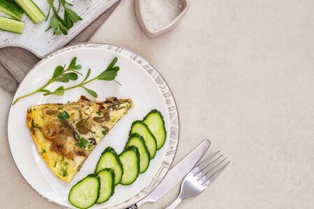 Frittata, an Italian dish made of whipped eggs, cheese and vegetables, cucumbers and purslaneの写真素材