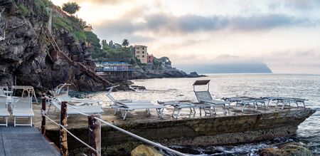 Bogliasco is ancient town near Genoa, Liguria, Italy. The promenade and deck chairs on the coastの写真素材