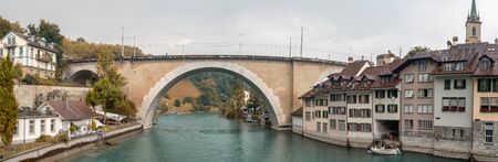 Bern, Switzerland. Panorama of the old city center and Nydeggbrucke bridge over the Aare riverの写真素材