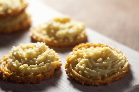 Shortbread cookies on a white wooden board. Close-up