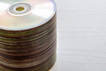 Lot of old compact discs stacked with a copy space