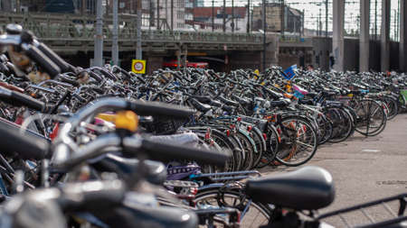 Lots of bikes in a parking lot in Amsterdam, Netherlands