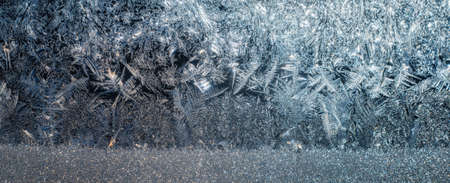 Winter pattern of frost on the window glassの写真素材