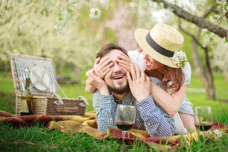 Young couple in love at a picnic in the park in the springの写真素材