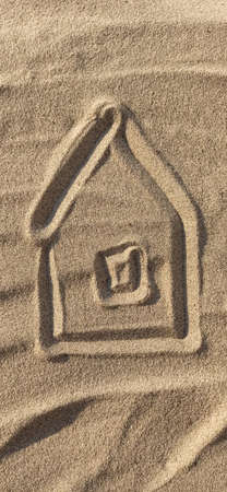 House painted on beach sandの写真素材