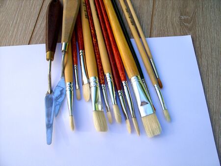 artist's brushes on a white sheetの写真素材
