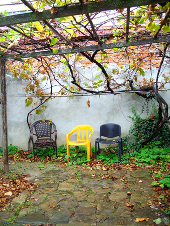 three chairs on the wallの写真素材