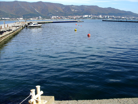 seascape with boat and mountainsの写真素材
