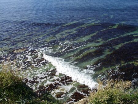 white foam on the sea waveの写真素材