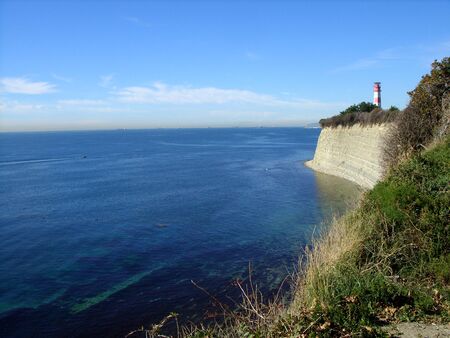 lighthouse on a rock near the seaの写真素材