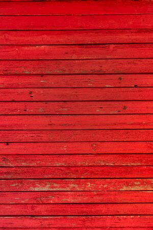 red horizontal wooden planks. vertical image. texture of painted woodの写真素材