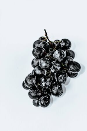 black grapes on an isolated background top view. of black grapesの写真素材