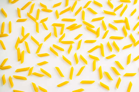 a group of pasta on a white background. Assortment of raw pasta. the concept of ingredients for cooking.の写真素材