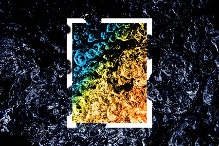 border design of abstract water splash with colorful graphic motion flow bubbles on dark background above white frameの写真素材