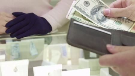 Customer pays for jewerly at the boutiqueの写真素材