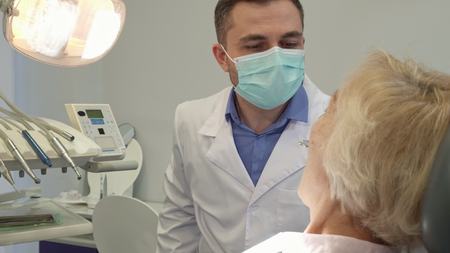 Dentist turns on the dental lightの写真素材
