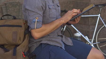 Cyclist flips on the tablet touchscreen